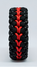 A black and red woven paracord bracelet shown vertically on a light gray background.